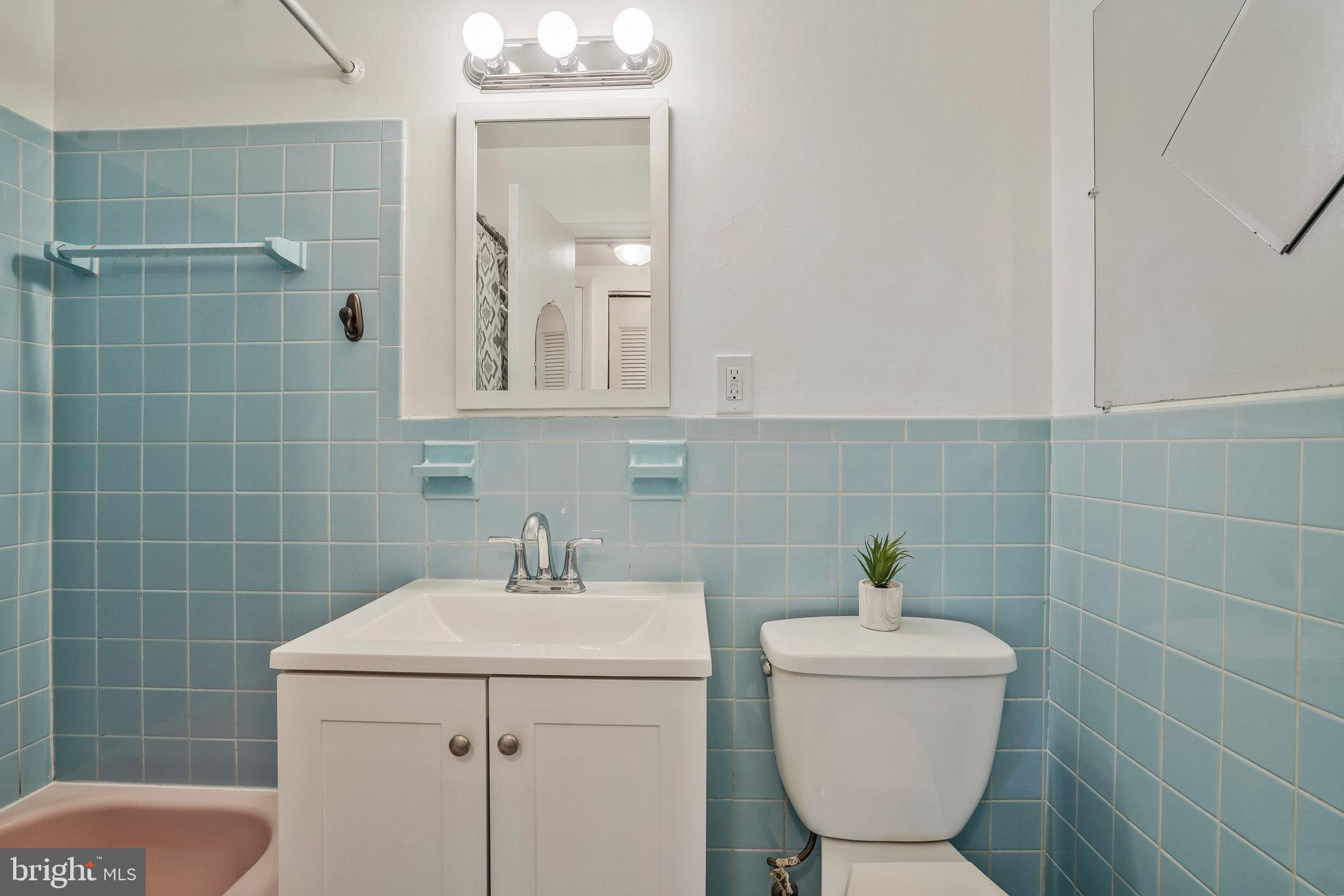 2754 Hollywood Road, Unit 301 Falls Church, VA 22043 - Photo 16 of 35 a bathroom with a toilet sink and mirror