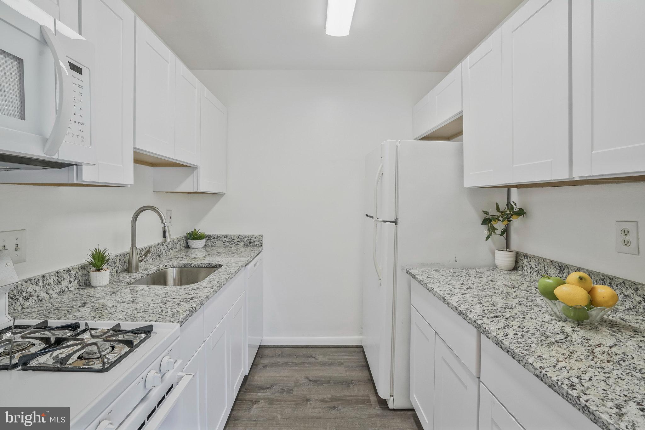 2754 Hollywood Road, Unit 301 Falls Church, VA 22043 - Photo 18 of 35 a kitchen with sink and cabinets