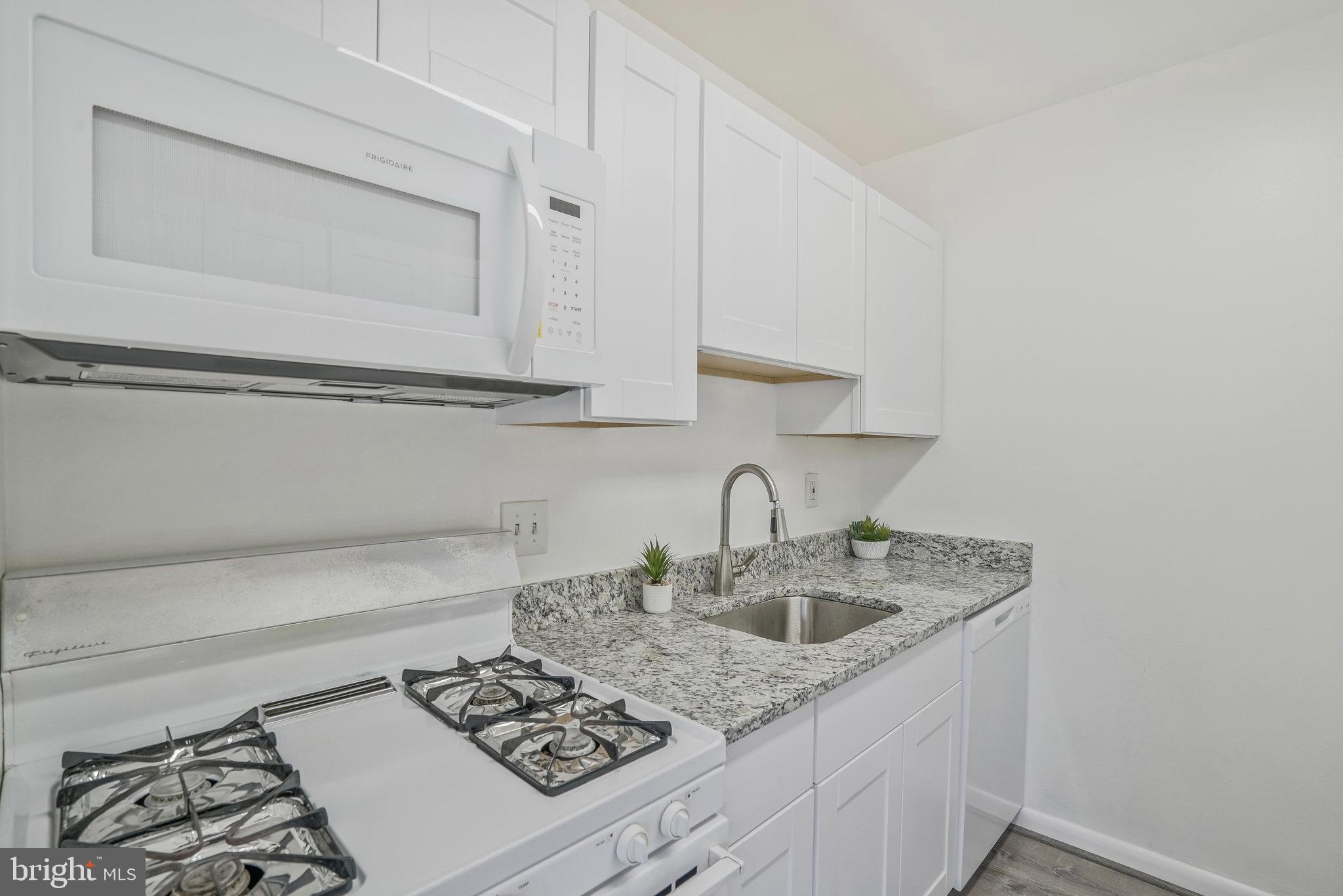 2754 Hollywood Road, Unit 301 Falls Church, VA 22043 - Photo 19 of 35 a kitchen with a sink and cabinets