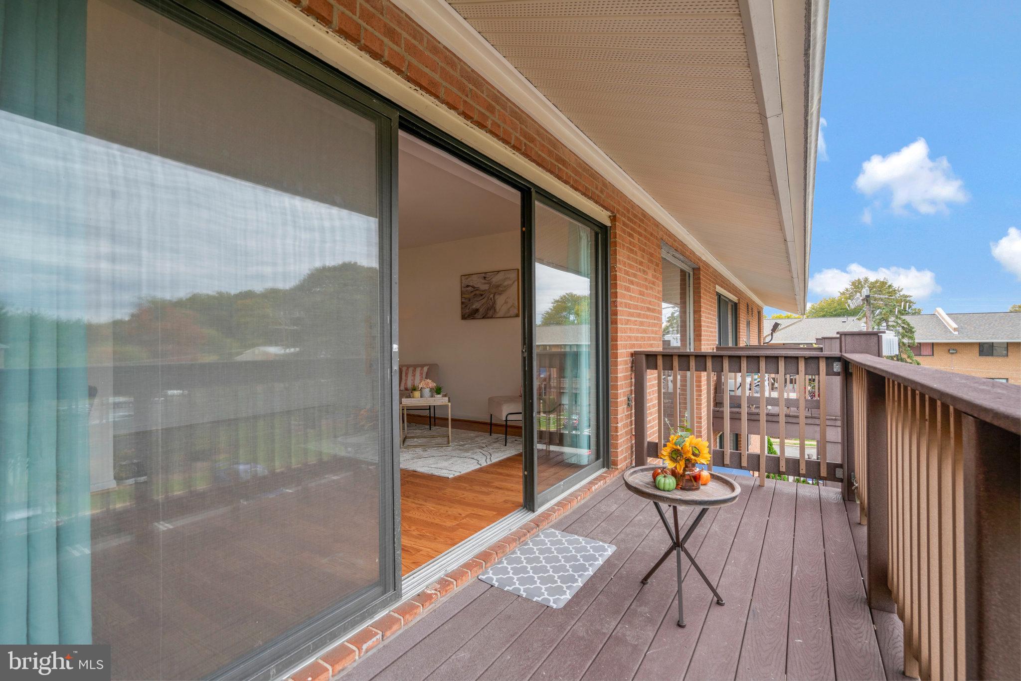 2754 Hollywood Road, Unit 301 Falls Church, VA 22043 - Photo 26 of 35 a balcony with wooden floor