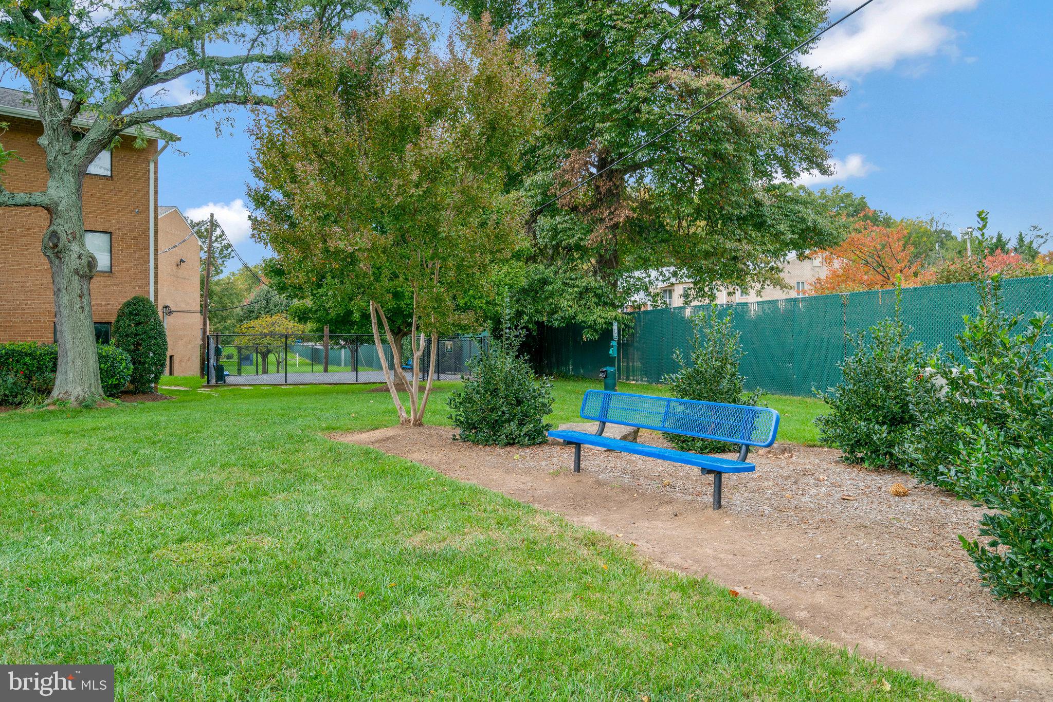 2754 Hollywood Road, Unit 301 Falls Church, VA 22043 - Photo 30 of 35 a park view with a bench and trees