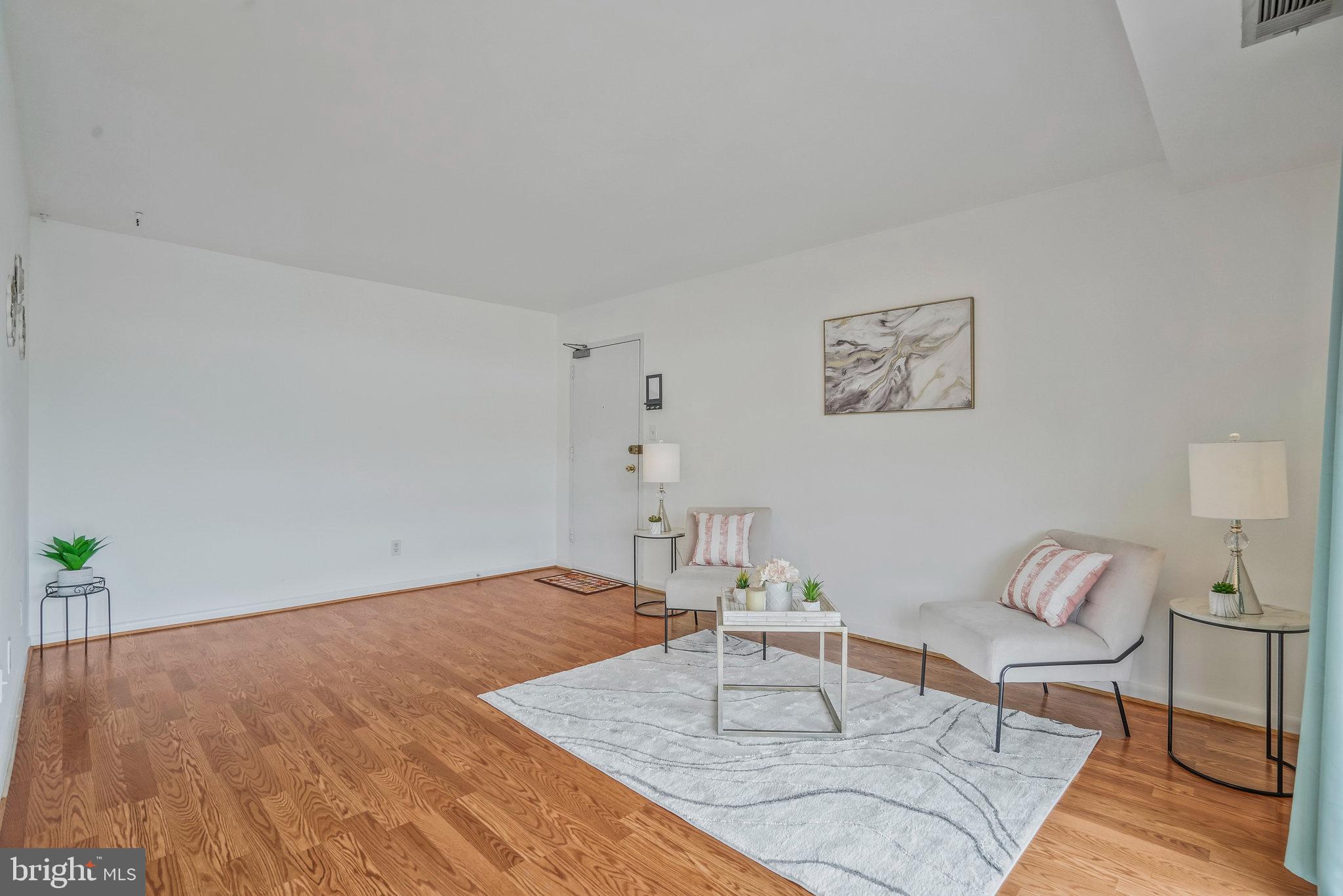 2754 Hollywood Road, Unit 301 Falls Church, VA 22043 - Photo 4 of 35 a living room with furniture and wooden floor