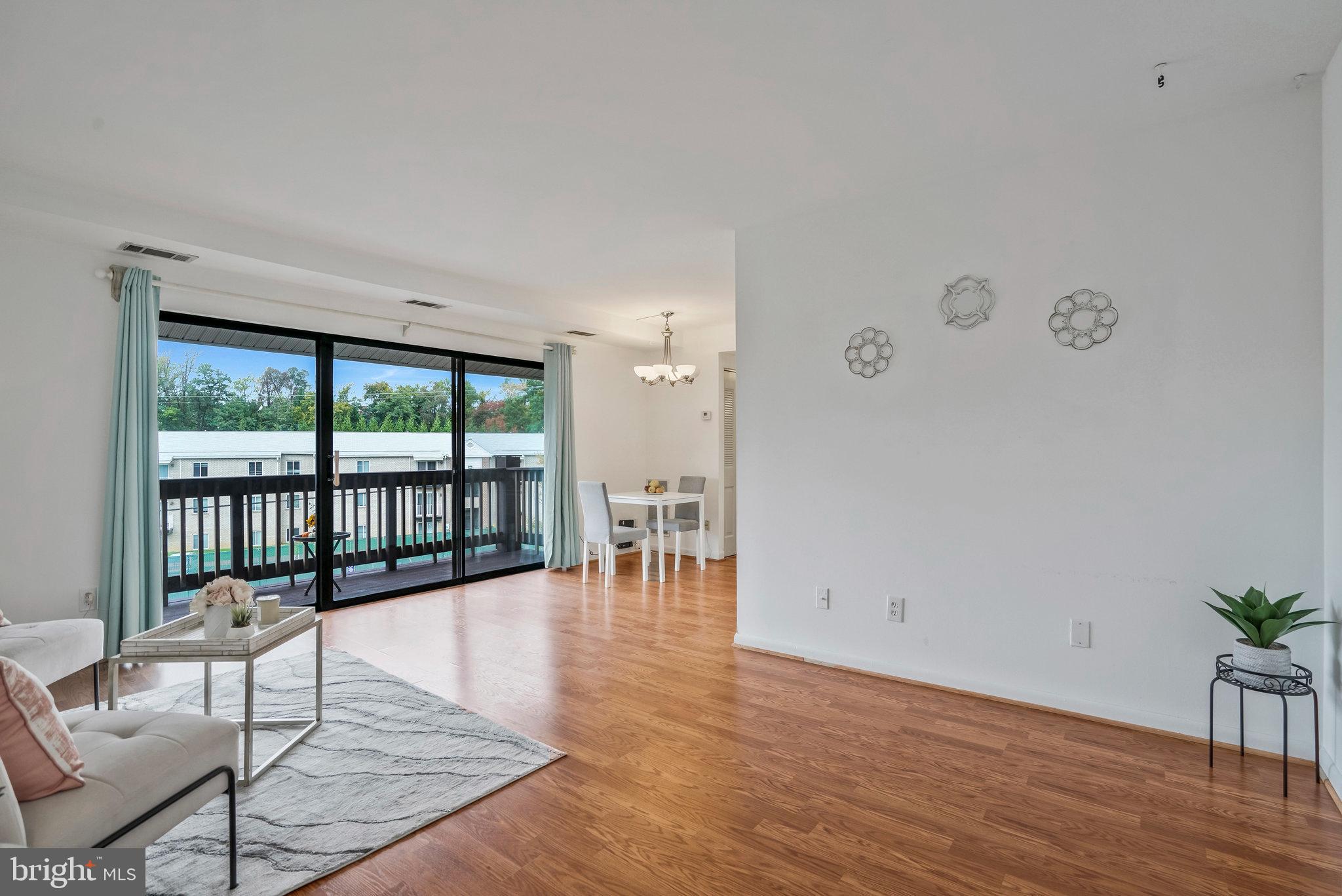 2754 Hollywood Road, Unit 301 Falls Church, VA 22043 - Photo 7 of 35 a living room with furniture and wooden floor