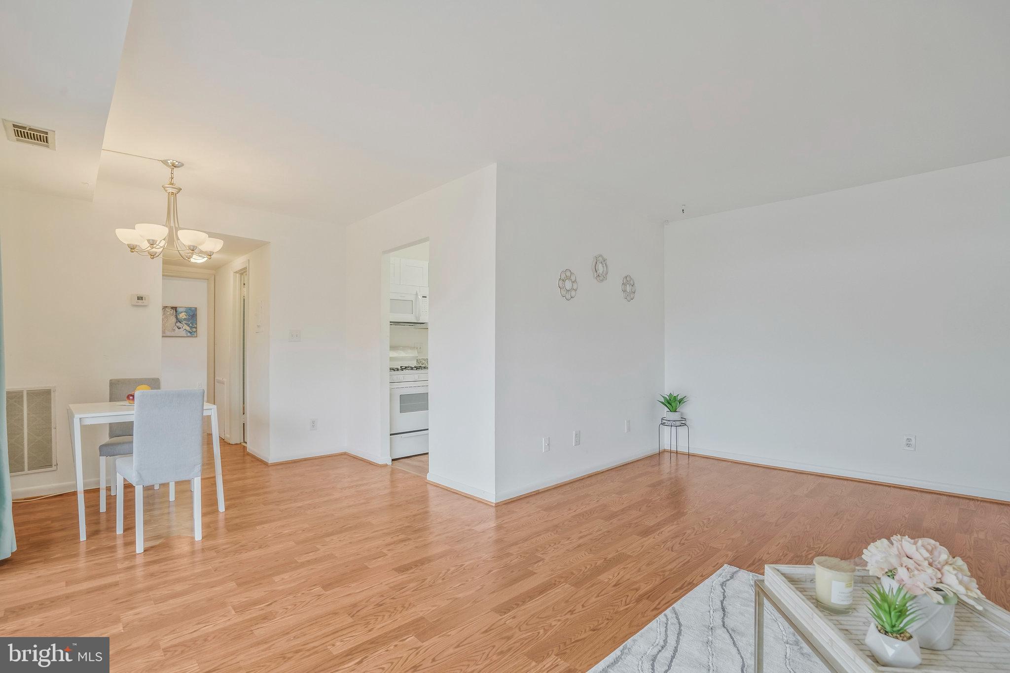 2754 Hollywood Road, Unit 301 Falls Church, VA 22043 - Photo 8 of 35 wooden floor in an empty room with a window
