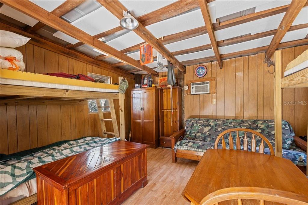 86 Southwest Turtle Pass Road Chiefland, FL 32626 - Photo 11 of 37 a bedroom with a bed and a dresser