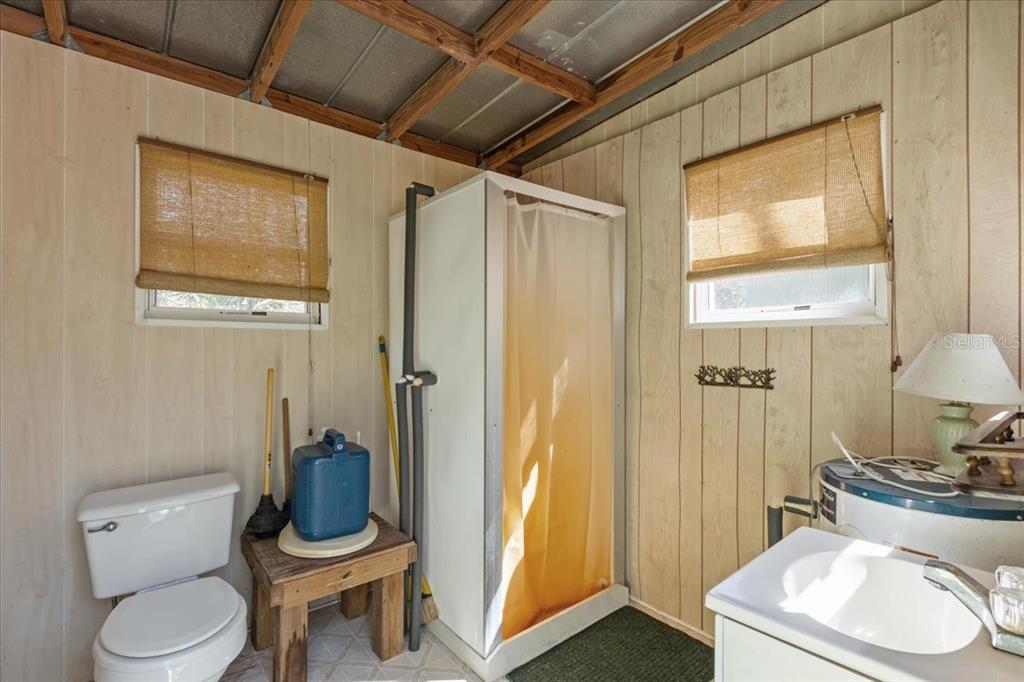 86 Southwest Turtle Pass Road Chiefland, FL 32626 - Photo 16 of 37 a bathroom with a toilet and a sink