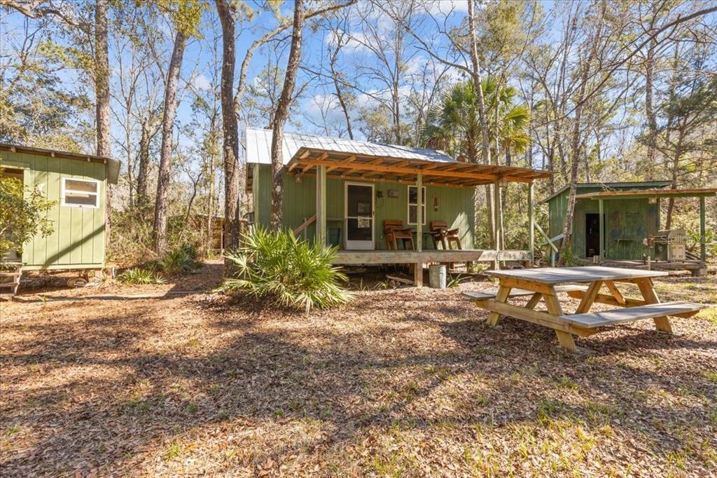 86 Southwest Turtle Pass Road Chiefland, FL 32626 - Photo 19 of 37 a front view of a house with garden