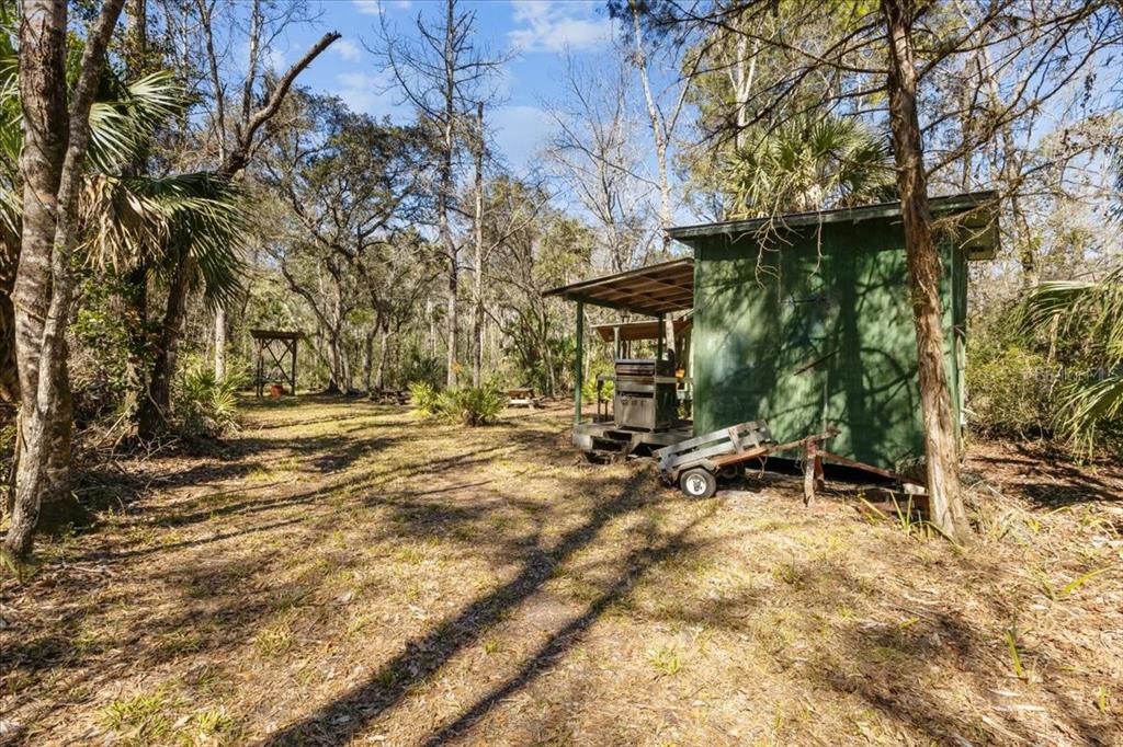 86 Southwest Turtle Pass Road Chiefland, FL 32626 - Photo 21 of 37 a view of outdoor space with deck and tree