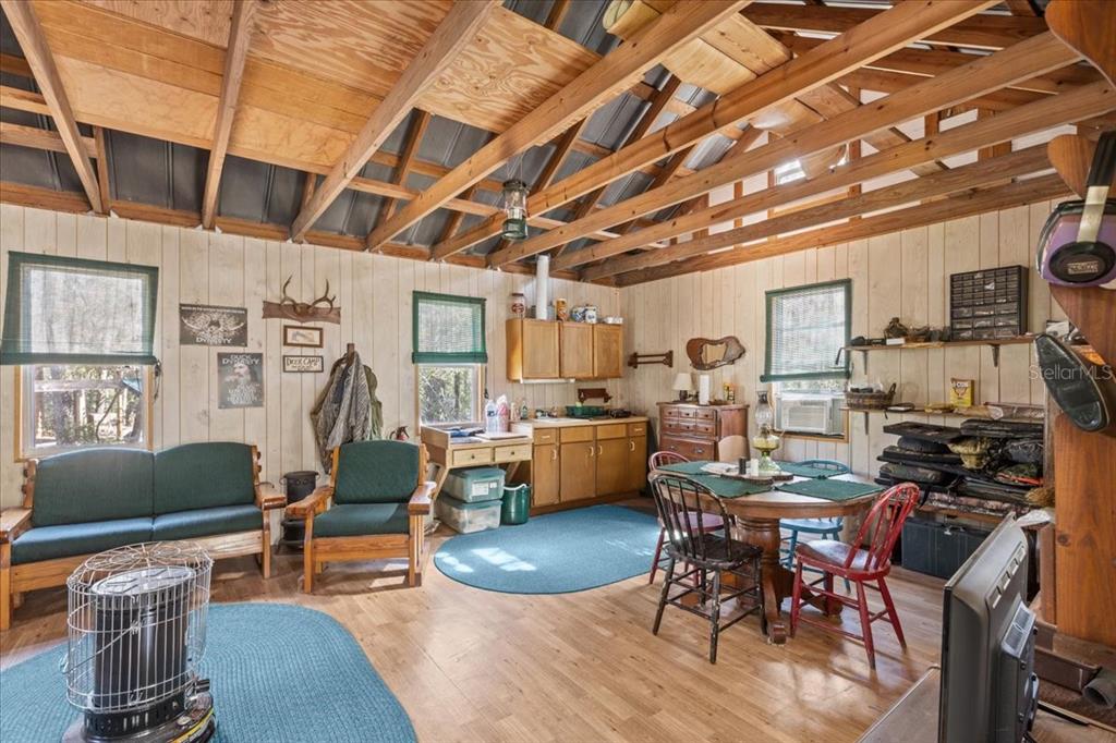 86 Southwest Turtle Pass Road Chiefland, FL 32626 - Photo 6 of 37 a living room with furniture and a flat screen tv