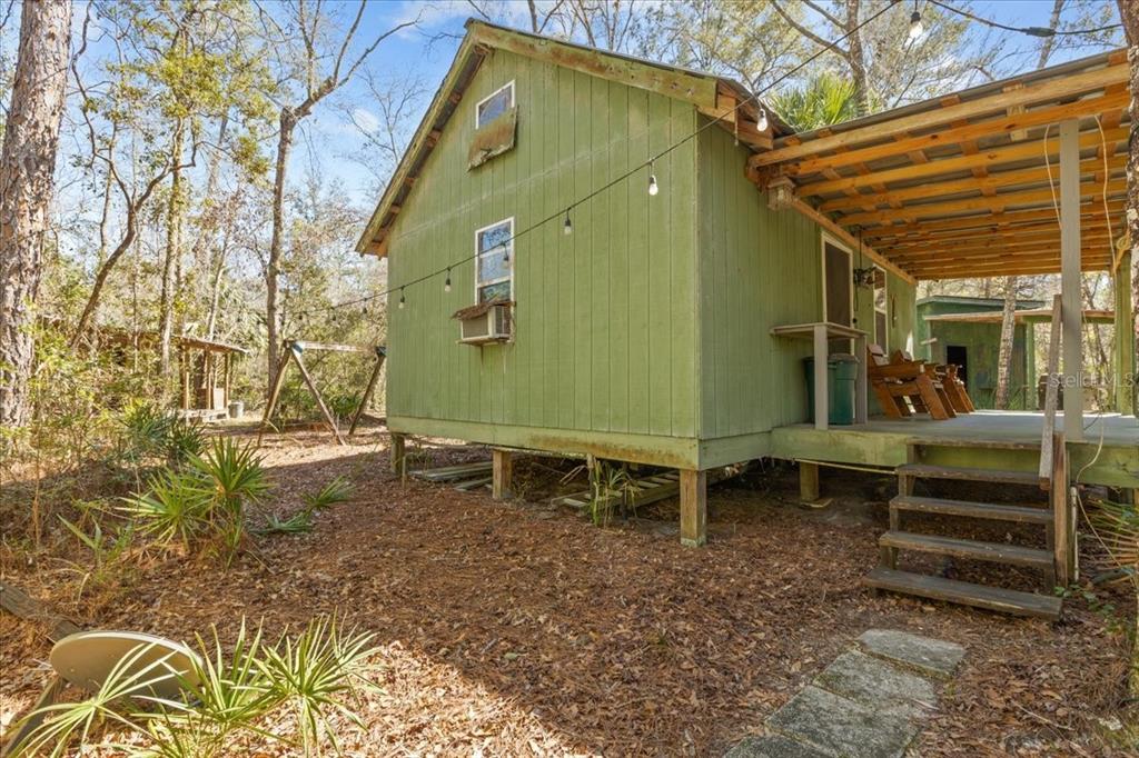 86 Southwest Turtle Pass Road Chiefland, FL 32626 - Photo 7 of 37 a backyard of a house