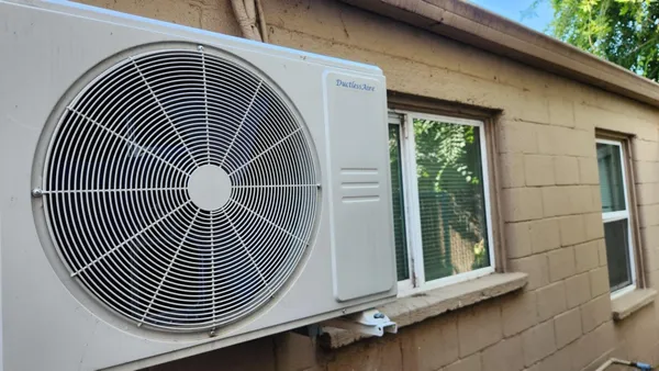 a view of wooden door and brick wall