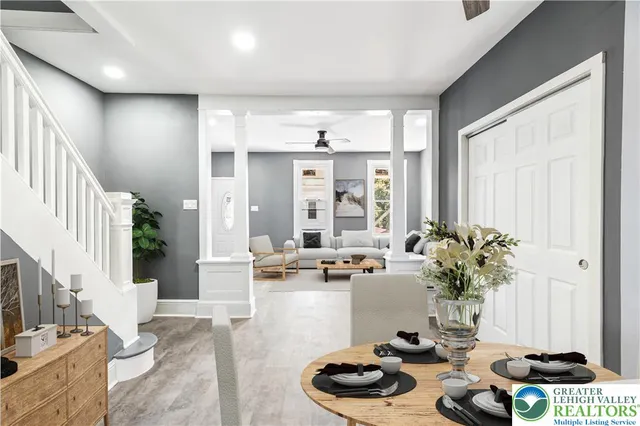 a living room with furniture and a table