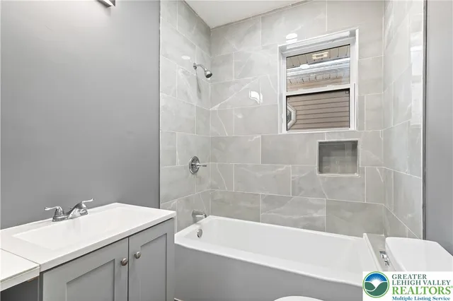 a bathroom with a sink and a bathtub