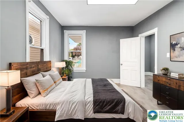 a bedroom with a bed and a dresser