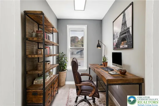 a view of a workspace with furniture