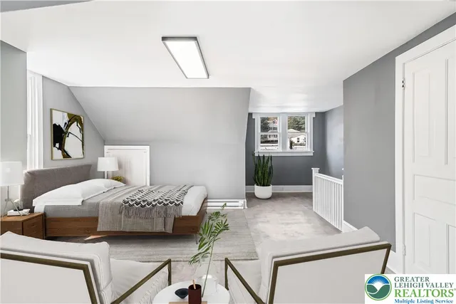 a bedroom with a bed and a view of kitchen