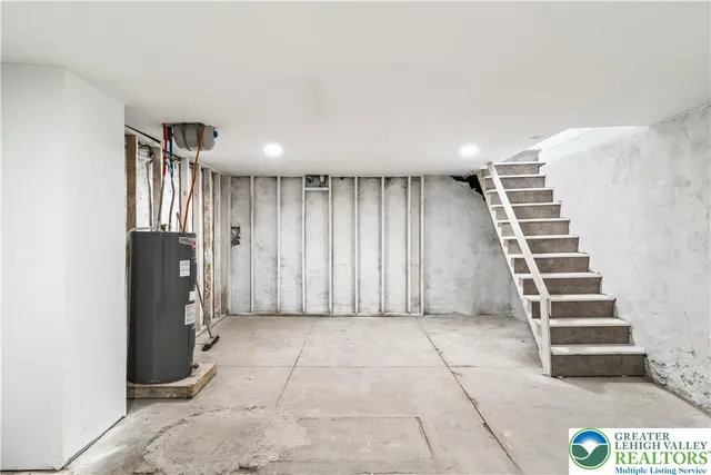 a view of a kitchen with entryway and stairs