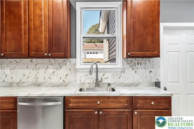 a kitchen with a sink and cabinets