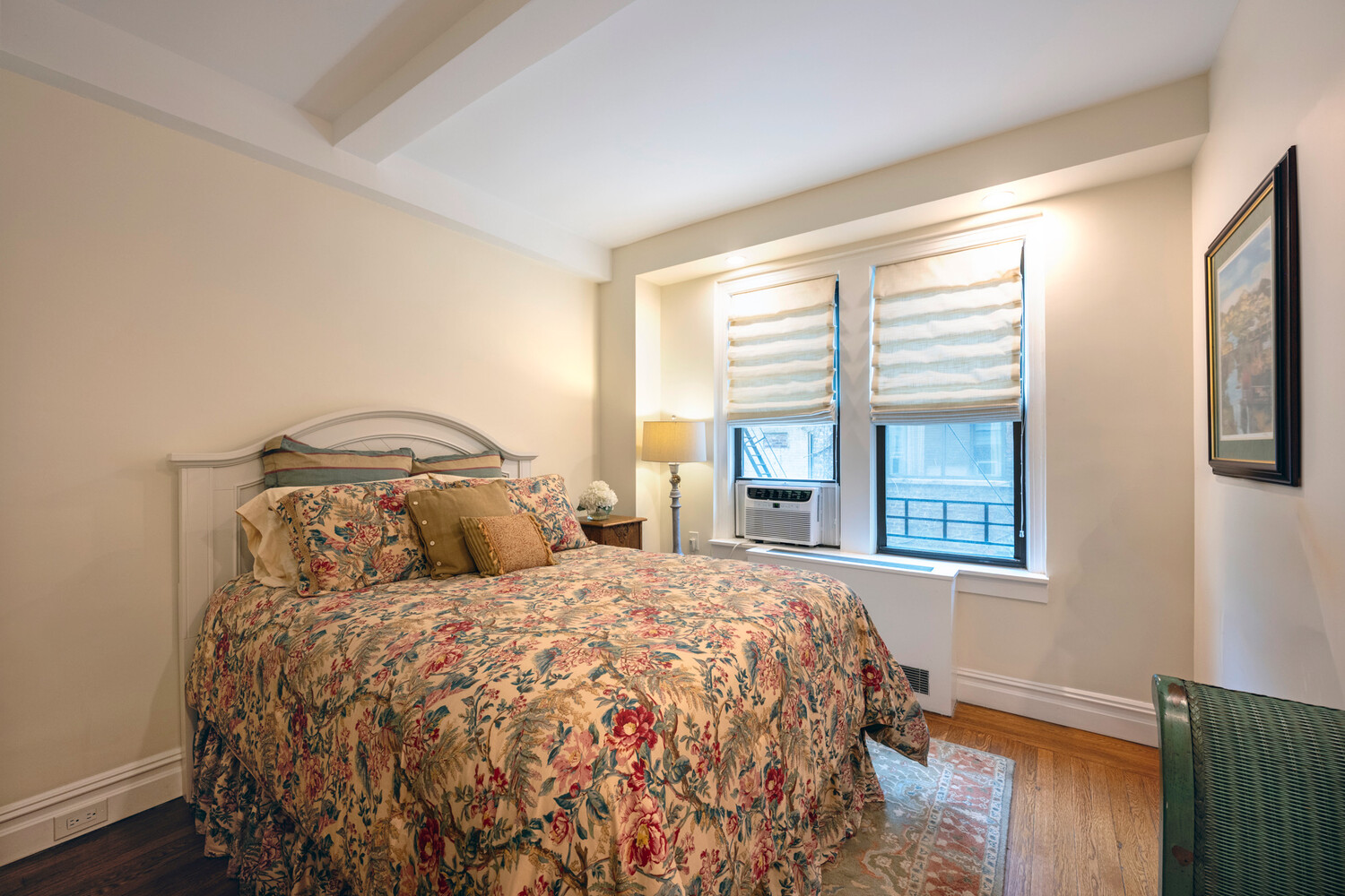 124 East 84th Street, Unit 5D Manhattan, NY 10028 - Photo 3 of 10 a bedroom with a bed and a window