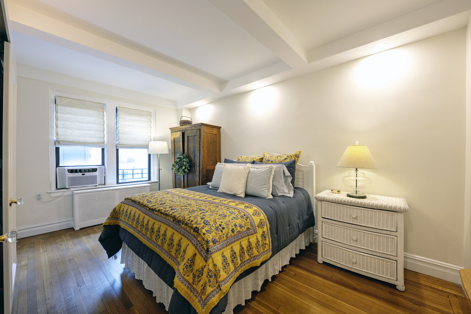 124 East 84th Street, Unit 5D Manhattan, NY 10028 - Photo 7 of 10 a bedroom with a bed and a window