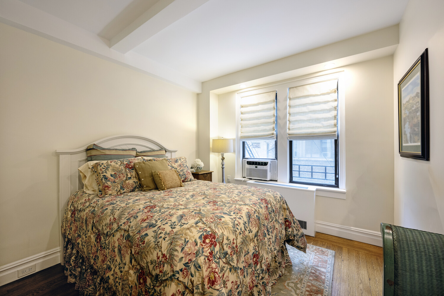 124 East 84th Street, Unit 5D Manhattan, NY 10028 - Photo 8 of 10 a bedroom with a bed and a window