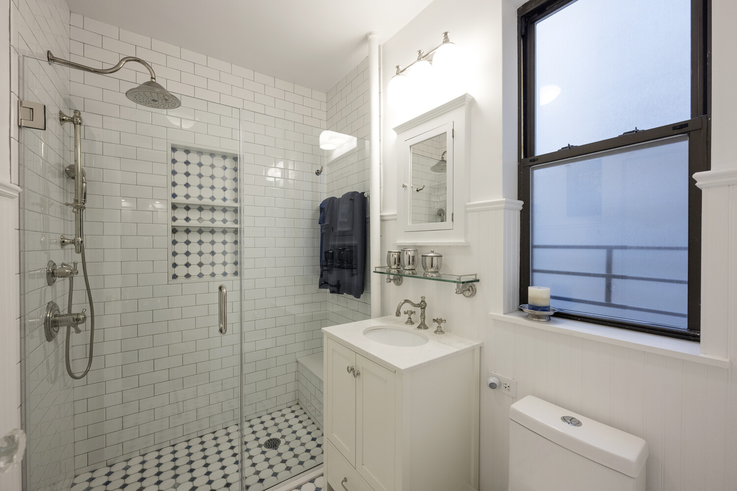 124 East 84th Street, Unit 5D Manhattan, NY 10028 - Photo 9 of 10 a bathroom with a sink a toilet and shower