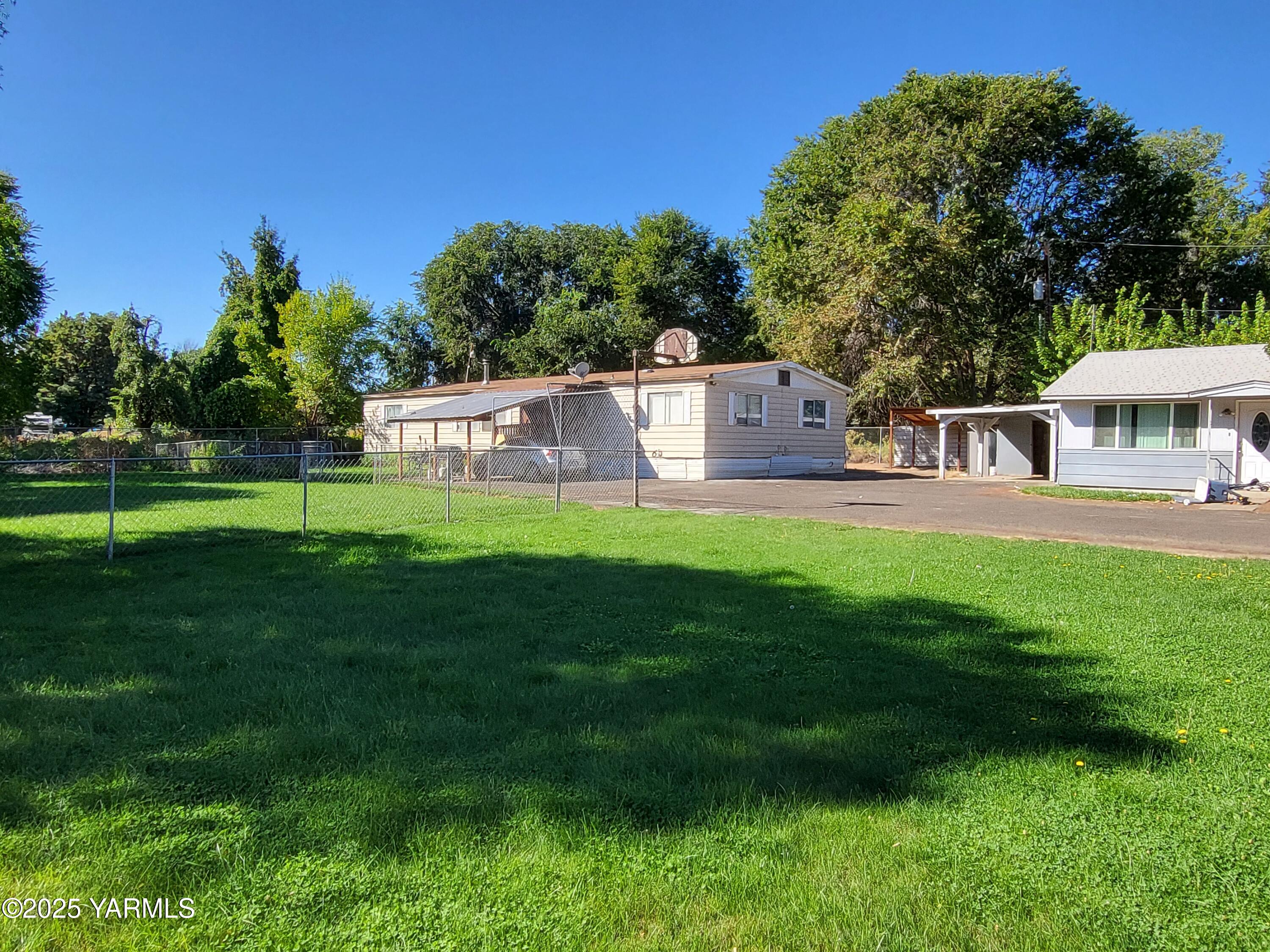 41-43 Curtis Street Harrah, WA 98933 - Photo 2 of 2 a view of a house with a big yard