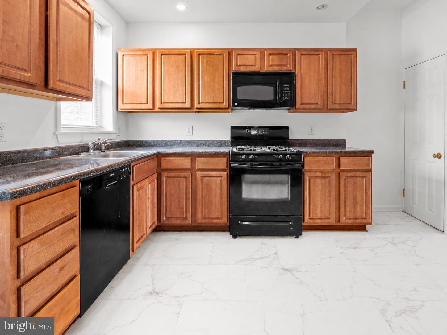 3915 Falls Road Baltimore, MD 21211 - Photo 8 of 23 Modern kitchen with warm wood tones.