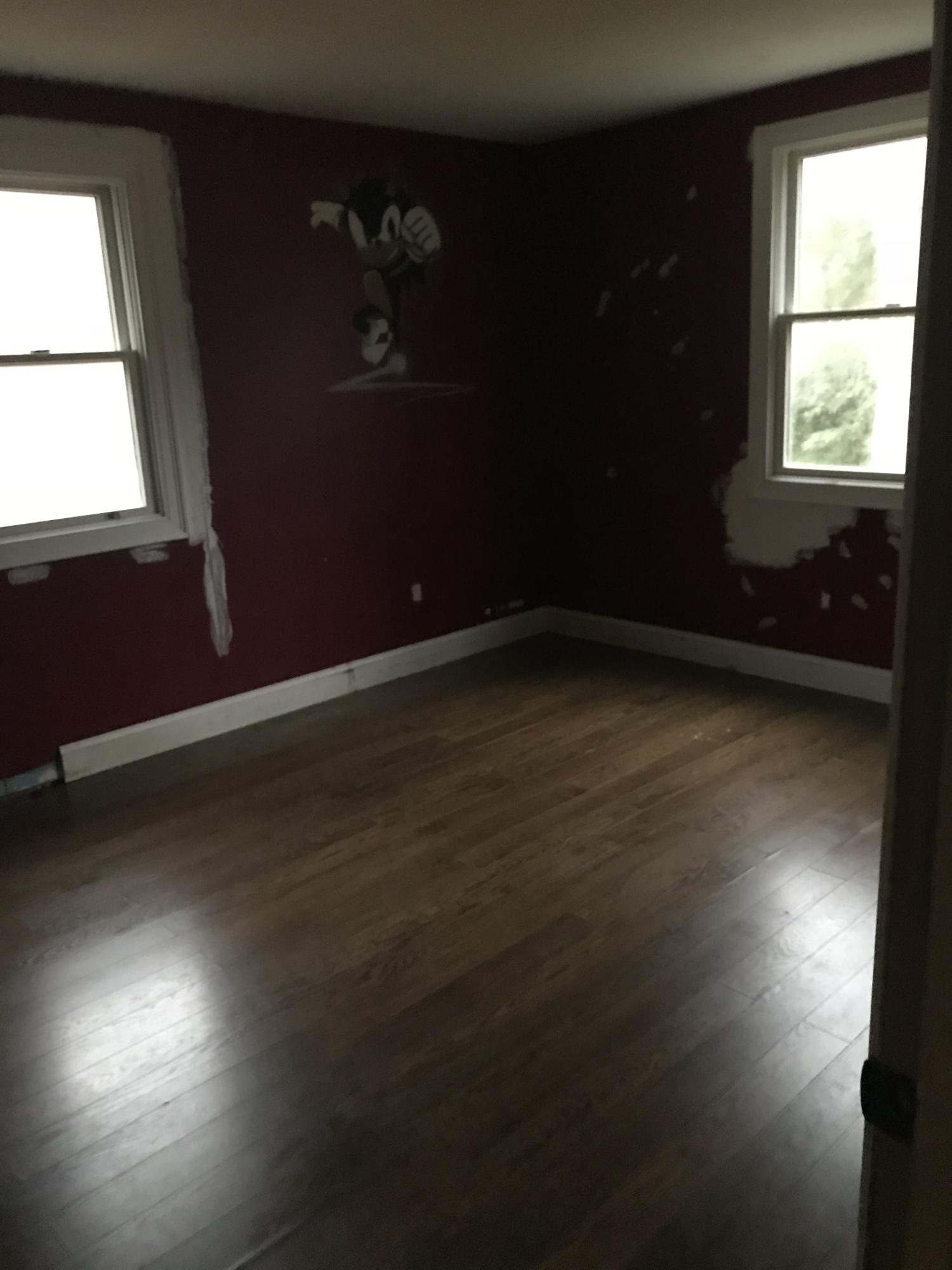 23 Stage Coach Road Centerville, MA 02632 - Photo 7 of 9 an empty room with wooden floor and windows