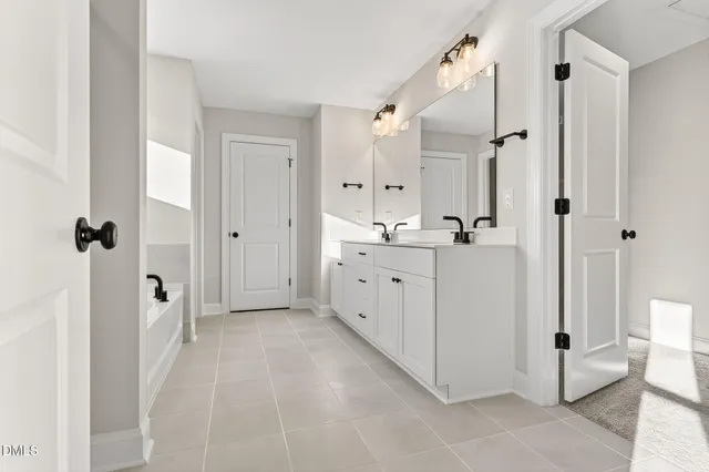a view of a bathroom with a sink and a mirror