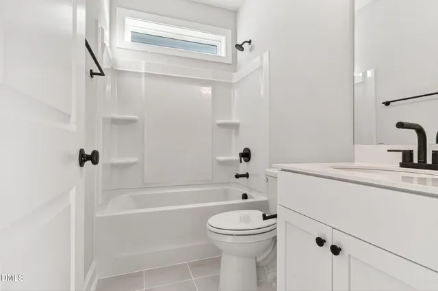 a bathroom with a sink a toilet and a bathtub