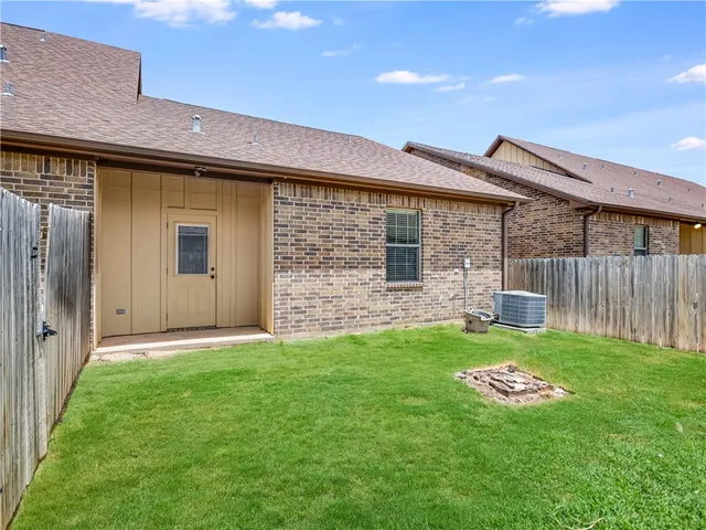 a backyard of a house with seating and garden