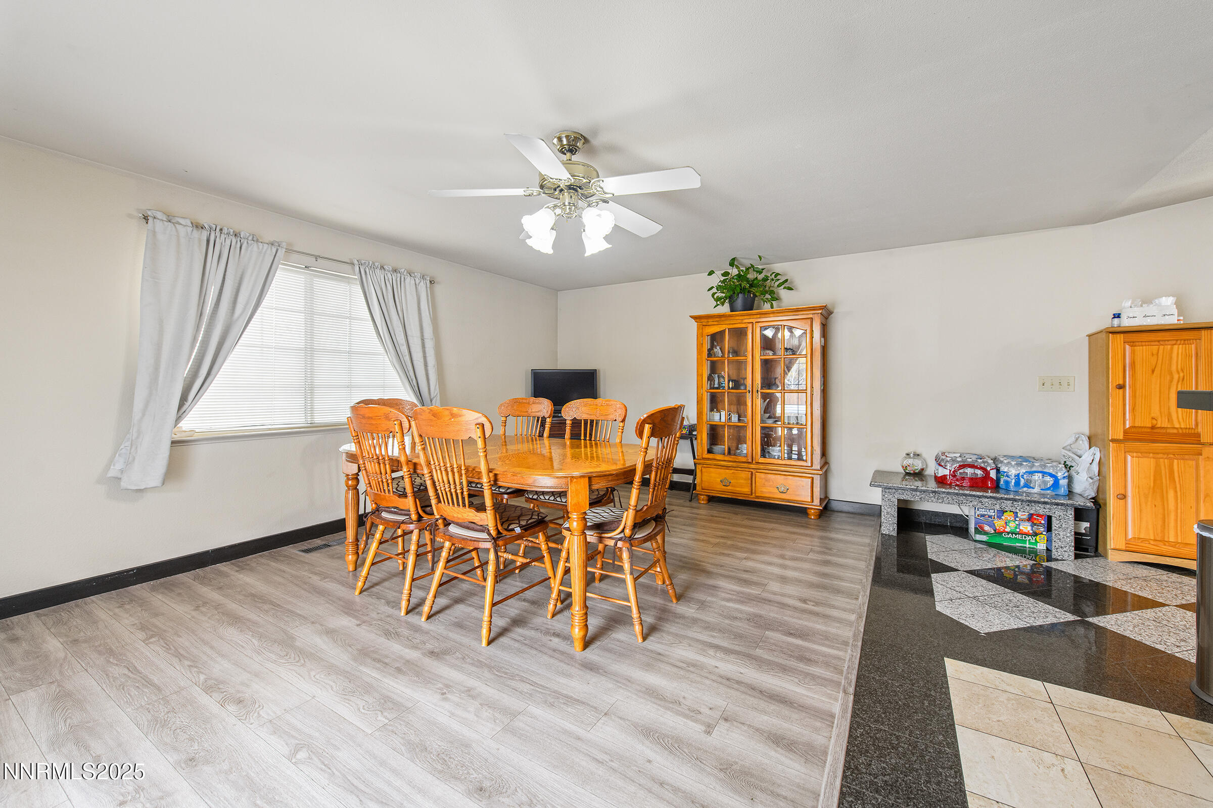532 Yellow Jacket Road Dayton, NV 89403 - Photo 12 of 18 a dining room with furniture a chandelier and wooden floor