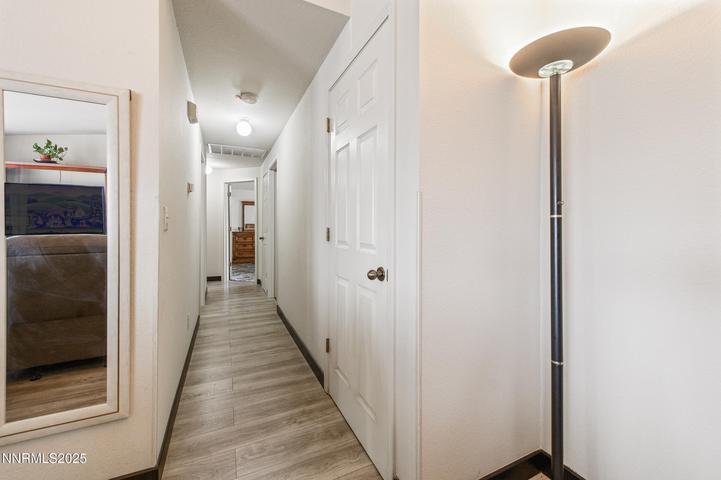 532 Yellow Jacket Road Dayton, NV 89403 - Photo 16 of 18 a view of a hallway with wooden floor
