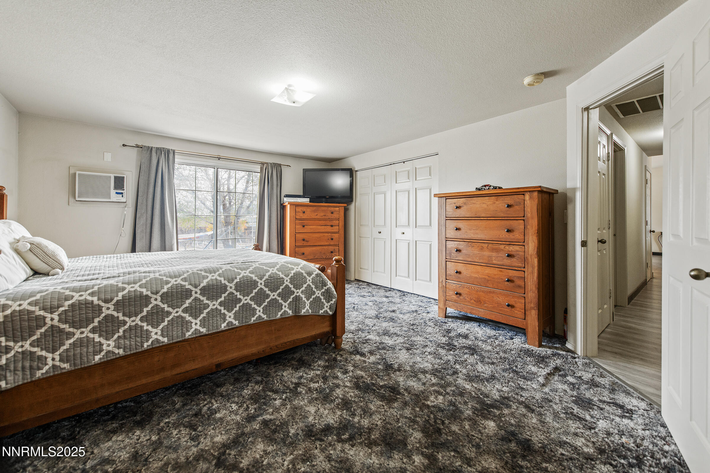 532 Yellow Jacket Road Dayton, NV 89403 - Photo 17 of 18 a bedroom with a large bed and a dresser
