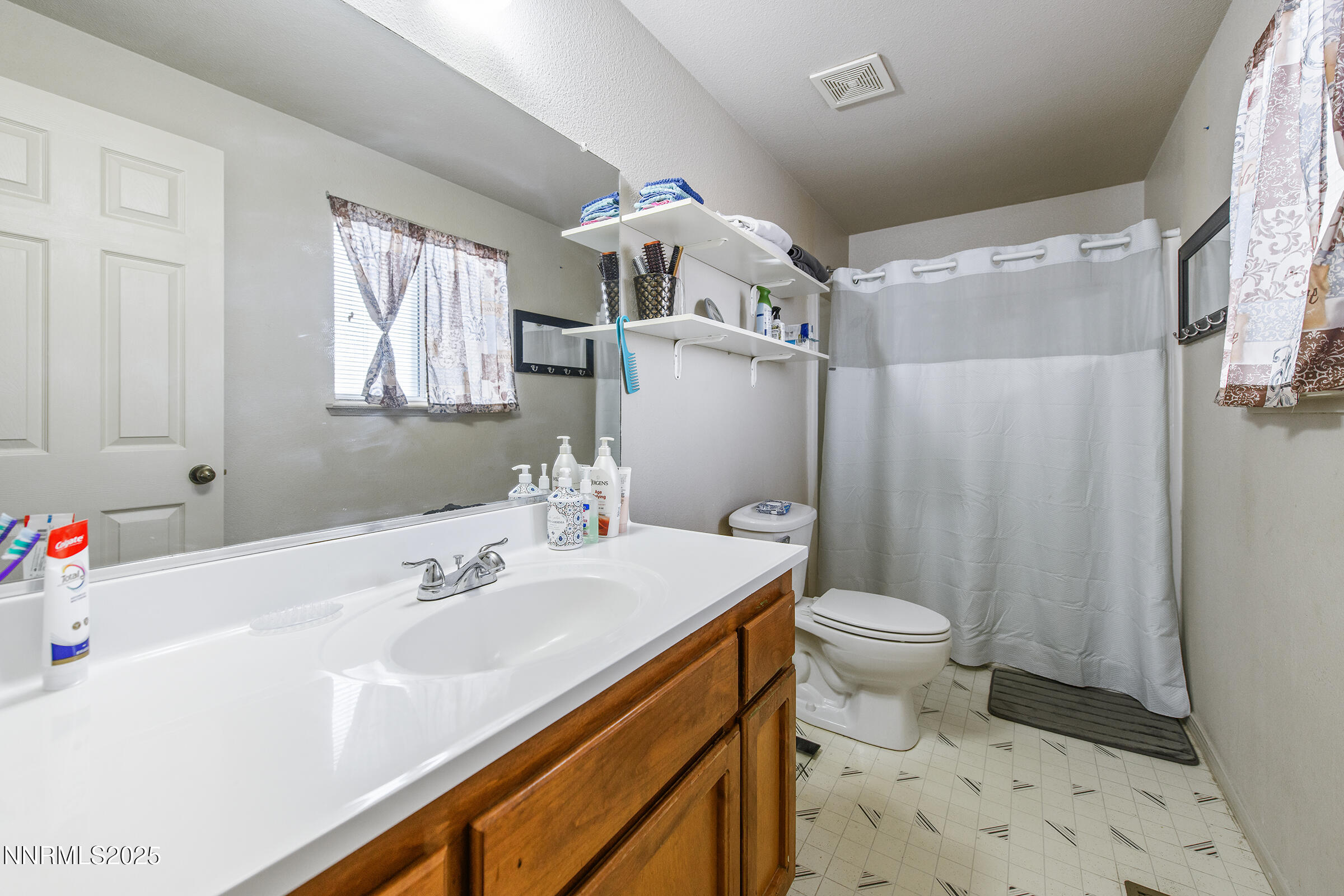 532 Yellow Jacket Road Dayton, NV 89403 - Photo 18 of 18 a bathroom with a sink toilet and shower