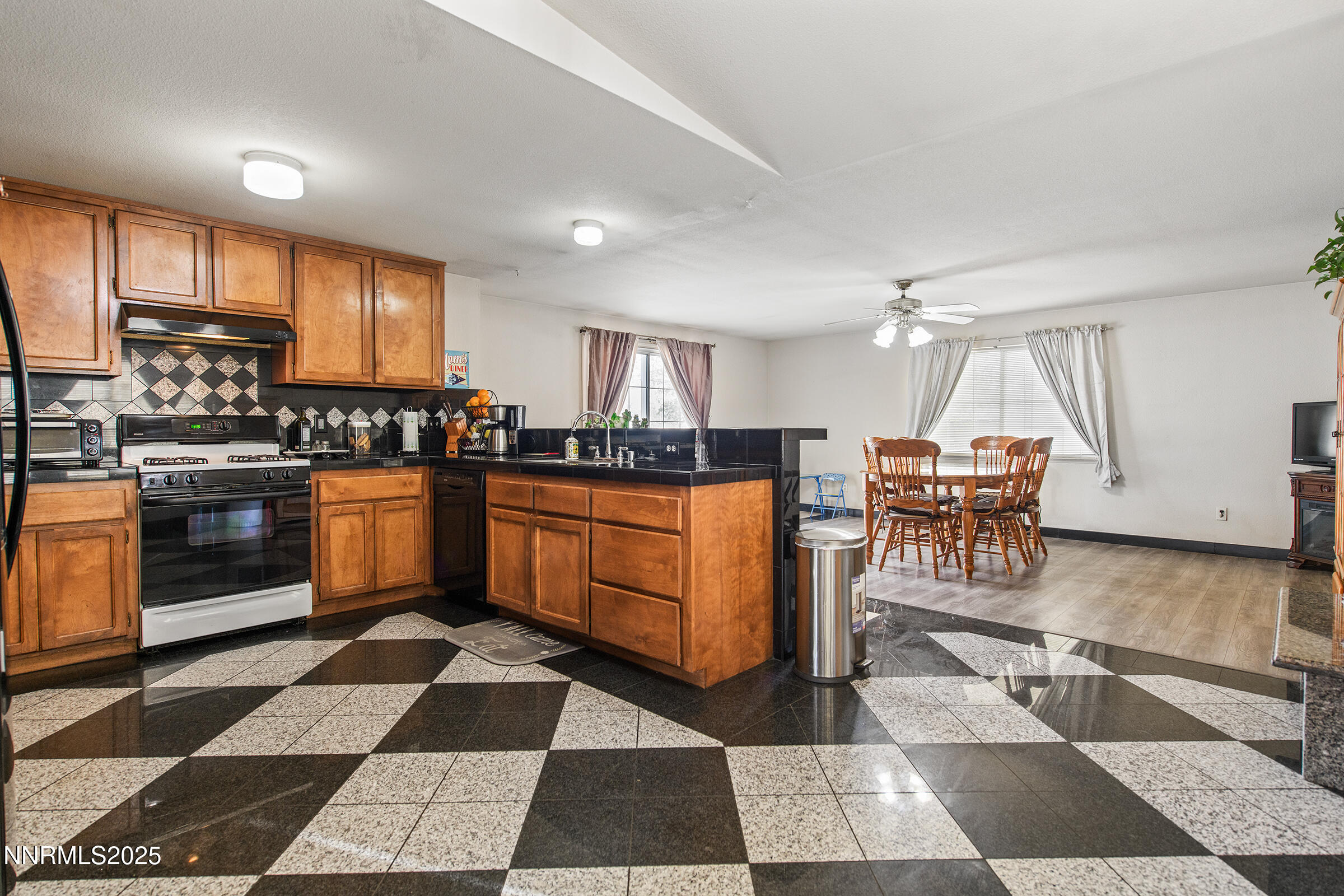 532 Yellow Jacket Road Dayton, NV 89403 - Photo 9 of 18 a kitchen with a stove a sink and a microwave