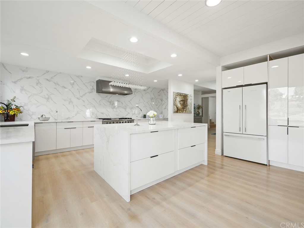 5100 Queen Street Riverside, CA 92506 - Photo 12 of 75 a kitchen with white cabinets and white appliances