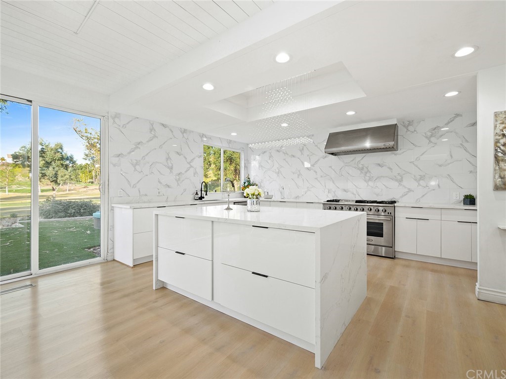 5100 Queen Street Riverside, CA 92506 - Photo 13 of 75 a kitchen with stainless steel appliances granite countertop a stove and a sink