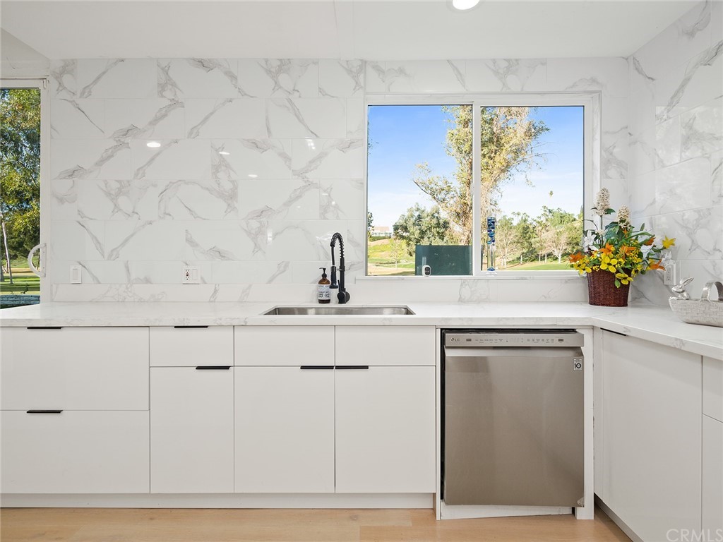 5100 Queen Street Riverside, CA 92506 - Photo 18 of 75 a bathroom with a sink mirror and vanity