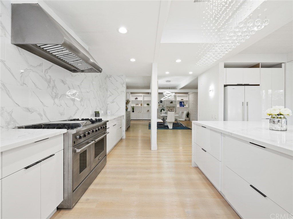 5100 Queen Street Riverside, CA 92506 - Photo 19 of 75 a kitchen with stainless steel appliances kitchen island granite countertop a stove a sink and a refrigerator