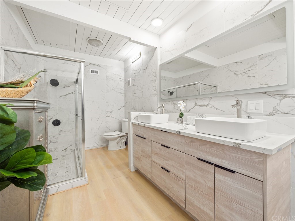 5100 Queen Street Riverside, CA 92506 - Photo 29 of 75 a bathroom with a sink double vanity and a shower