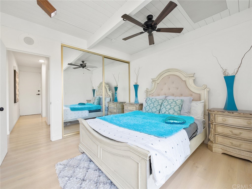 5100 Queen Street Riverside, CA 92506 - Photo 38 of 75 a living room with a bed furniture and a chandelier