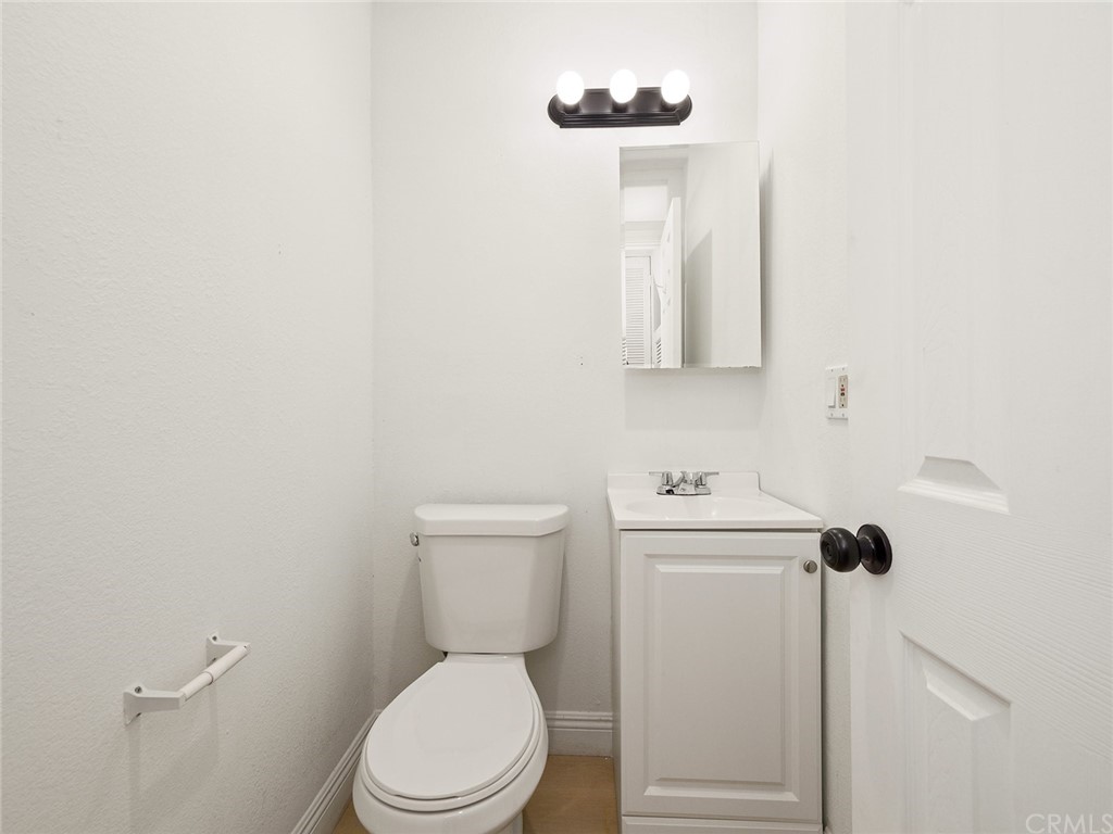 5100 Queen Street Riverside, CA 92506 - Photo 43 of 75 a white toilet sitting next to a bathroom sink