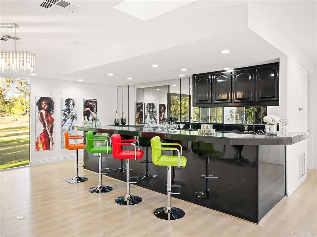 5100 Queen Street Riverside, CA 92506 - Photo 49 of 75 a kitchen with stainless steel appliances kitchen island granite countertop a refrigerator and a sink