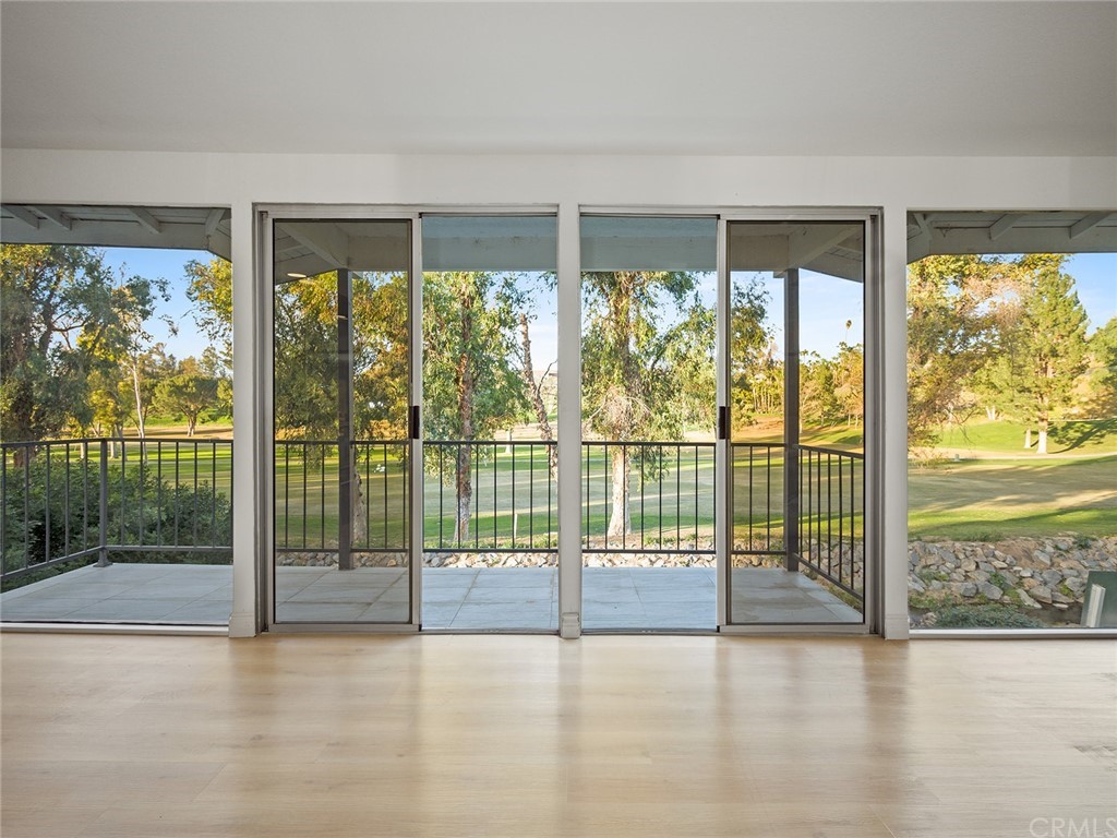 5100 Queen Street Riverside, CA 92506 - Photo 54 of 75 a view of an empty room with wooden floor and a floor to ceiling window
