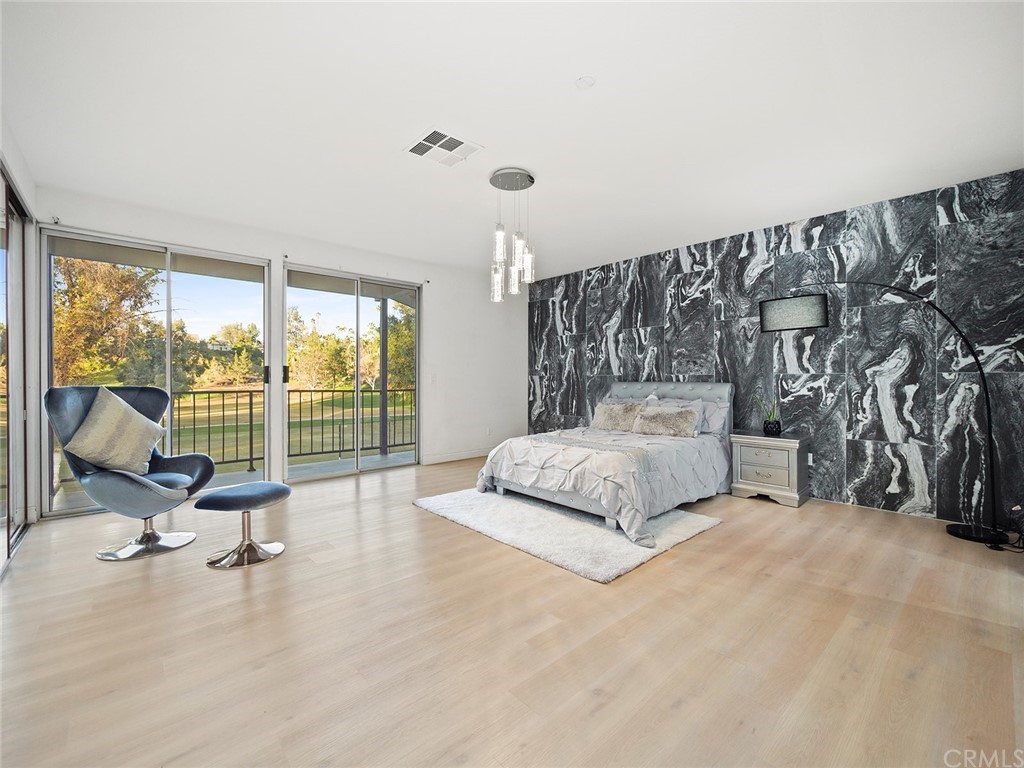 5100 Queen Street Riverside, CA 92506 - Photo 65 of 75 a spacious bedroom with a bed and large windows