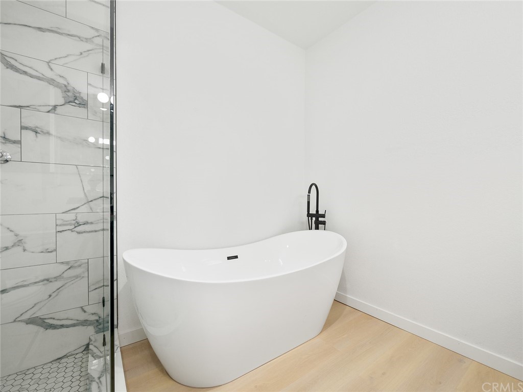 5100 Queen Street Riverside, CA 92506 - Photo 68 of 75 a white bath tub sitting in a bathroom