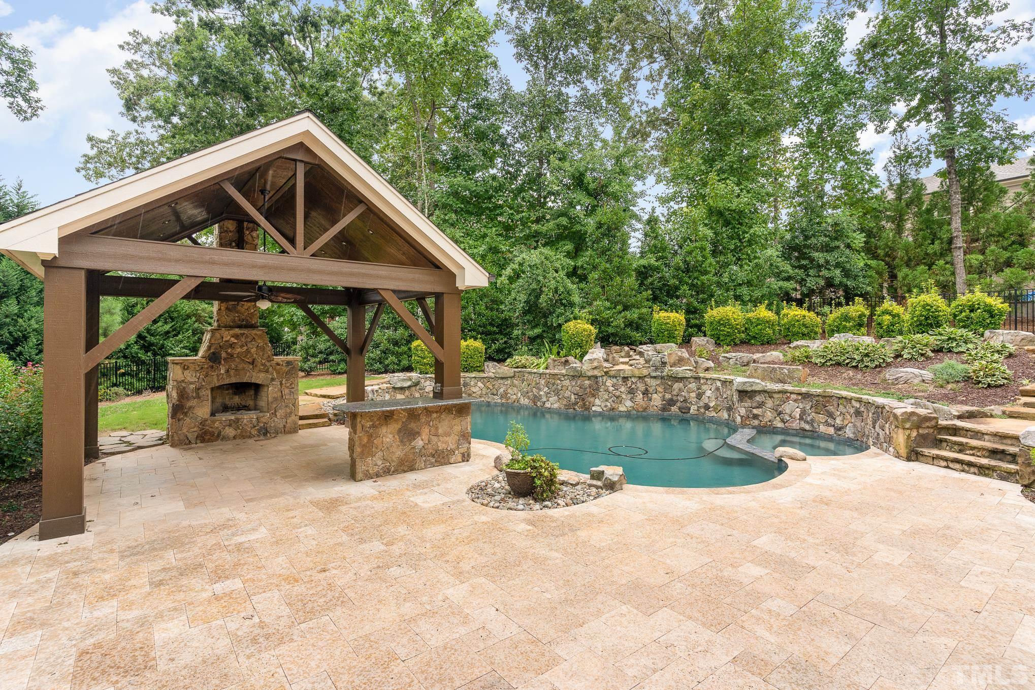 5004 Greyhawk Place Apex, NC 27539 - Photo 28 of 36 a front view of a house with garden