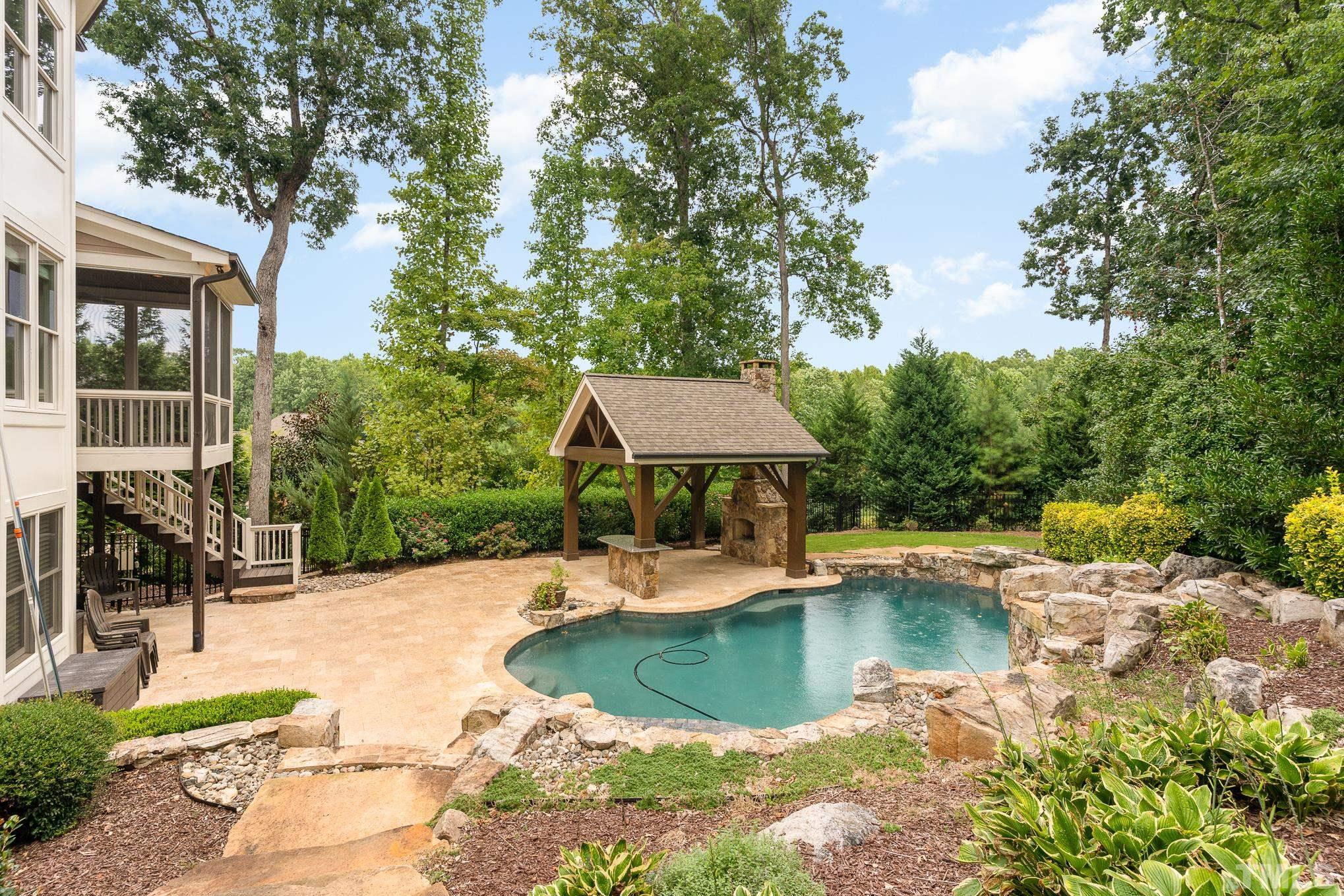 5004 Greyhawk Place Apex, NC 27539 - Photo 29 of 36 a swimming pool with outdoor seating yard and outdoor seating